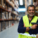 Happy hispanic man working in warehouse logistic Happy hispanic man working in warehouse logistic - PhotoDune Item for Sale