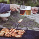Natural background. Summer. Men roasts kebab on the grill and drink beer Natural background. Summer. Men roasts kebab on the grill and drink beer - PhotoDune Item for Sale
