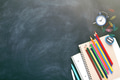 School Stationary: pen, pencils, notebook on Blackboard. School Stationary: pen, pencils, notebook on Blackboard. - PhotoDune Item for Sale