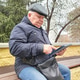 Senior man with tablet on park bench digital literacy Senior man with tablet on park bench digital literacy - PhotoDune Item for Sale
