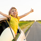 A little girl travels by car, a happy child smiles from the car window, the road to the distance A little girl travels by car, a happy child smiles from the car window, the road to the distance - PhotoDune Item for Sale