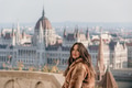 Portrait of beautiful young woman on balcony overlooking Hungarian Parliament in Budapest, Hungary Portrait of beautiful young woman on balcony overlooking Hungarian Parliament in Budapest, Hungary - PhotoDune Item for Sale