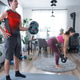 Together at home gym, man with barbell, woman uses mat, modern apartment with light Together at home gym, man with barbell, woman uses mat, modern apartment with light - PhotoDune Item for Sale