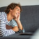 Happy young man relaxing on sofa watching movie on laptop Happy young man relaxing on sofa watching movie on laptop - PhotoDune Item for Sale