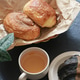 Close up a cup of tea and pastries on dark slate background Close up a cup of tea and pastries on dark slate background - PhotoDune Item for Sale
