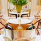 Three bottles of champagne in a luxurious bucket on the table. Three bottles of champagne in a luxurious bucket on the table. - PhotoDune Item for Sale
