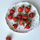 Ripe red strawberries on a plate with hearts Ripe red strawberries on a plate with hearts - PhotoDune Item for Sale