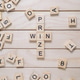 A wooden cross with the letters WIN PRIZE written in the middle A wooden cross with the letters WIN PRIZE written in the middle - PhotoDune Item for Sale