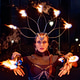 Fire dancer performing with flaming torches at night Fire dancer performing with flaming torches at night - PhotoDune Item for Sale