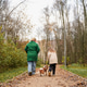 Walking mother with daughter, dog on park path. Family pet activity supports bonding, care Walking mother with daughter, dog on park path. Family pet activity supports bonding, care - PhotoDune Item for Sale