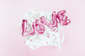 Love concept. Inflatable pink balloon with letters Love concept. Inflatable pink balloon with letters - PhotoDune Item for Sale