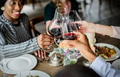 People Clinging Wine Glasses Together in Restaurant People Clinging Wine Glasses Together in Restaurant - PhotoDune Item for Sale