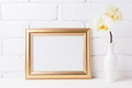 Golden landscape frame mockup with soft yellow orchid in vase Golden landscape frame mockup with soft yellow orchid in vase - PhotoDune Item for Sale