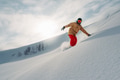 snowboarder is riding from snow hill snowboarder is riding from snow hill - PhotoDune Item for Sale