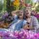 Two happy Asian senior women laugh together in a colorful flower garden Two happy Asian senior women laugh together in a colorful flower garden - PhotoDune Item for Sale