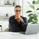 Positive and cheerful caucasian businesswoman in a black shirt and glasses, sitting at the desk with Positive and cheerful caucasian businesswoman in a black shirt and glasses, sitting at the desk with - PhotoDune Item for Sale