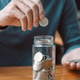 Man putting coins into bottle planning growing saving to strategy with money box for future plan Man putting coins into bottle planning growing saving to strategy with money box for future plan - PhotoDune Item for Sale