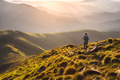 Girl on mountain peak with looking at beautiful mountain valley Girl on mountain peak with looking at beautiful mountain valley - PhotoDune Item for Sale