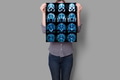 Hands hold MRI scan of head, neck and brain of patient, holding in hands. Hands hold MRI scan of head, neck and brain of patient, holding in hands. - PhotoDune Item for Sale