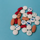 Different colored tablets on a blue background Different colored tablets on a blue background - PhotoDune Item for Sale