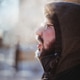 Bearded man exhales steam on the street in winter Bearded man exhales steam on the street in winter - PhotoDune Item for Sale