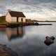 Traditional stone cottage fisherman hut lakeside of Connemara national park Ireland at sunrise Traditional stone cottage fisherman hut lakeside of Connemara national park Ireland at sunrise - PhotoDune Item for Sale