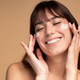 Beautiful young woman applying face luxury sunscreen or moisturizer cream Beautiful young woman applying face luxury sunscreen or moisturizer cream - PhotoDune Item for Sale