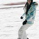 brunette smiling girl snowboarding in the evening, in motion brunette smiling girl snowboarding in the evening, in motion - PhotoDune Item for Sale