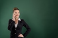 Smiling pretty businesswoman talks on the phone on green background Smiling pretty businesswoman talks on the phone on green background - PhotoDune Item for Sale