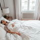 Woman in bed with headphones listening to meditation or relaxing sleep music Woman in bed with headphones listening to meditation or relaxing sleep music - PhotoDune Item for Sale