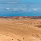 Panoramic view of Agafay village in the Moroccan desert with distant snow-capped mountains Panoramic view of Agafay village in the Moroccan desert with distant snow-capped mountains - PhotoDune Item for Sale