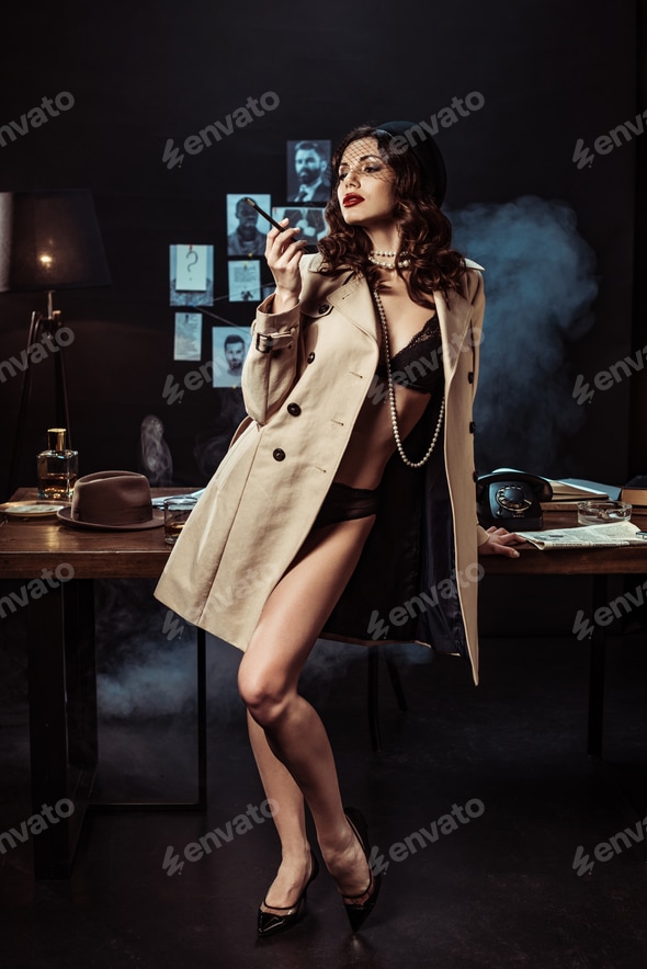 Sexy girl in black lingerie and trench coat holding mouthpiece in dark office Stock Photo by LightFieldStudios Sexy girl in black lingerie and trench coat holding mouthpiece in dark office Stock Photo by LightFieldStudios