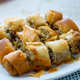 Crispy spring rolls filled with vegetables and meat, served on white plate Crispy spring rolls filled with vegetables and meat, served on white plate - PhotoDune Item for Sale