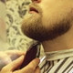 Barber shaves beard of client man on chair Barbershop. Beard Haircut. Barber shaves beard of client man on chair Barbershop. Beard Haircut. - PhotoDune Item for Sale
