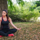 Peaceful Young Woman Meditating In Lotus Pose Under Big Tree Near Lake Peaceful Young Woman Meditating In Lotus Pose Under Big Tree Near Lake - PhotoDune Item for Sale