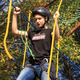 Girl in safety equipment hiking in the rope park. Climbing adventure park. Sport, outdoors activity Girl in safety equipment hiking in the rope park. Climbing adventure park. Sport, outdoors activity - PhotoDune Item for Sale