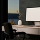 White screen computer on wooden table with armchair aside window and dark wall in a dim lit room. White screen computer on wooden table with armchair aside window and dark wall in a dim lit room. - PhotoDune Item for Sale