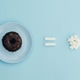 A donut with sugar on a blue background. A donut with sugar on a blue background. - PhotoDune Item for Sale