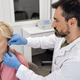 Audiologist setting a hearing aid for a client, ensuring optimal performance Audiologist setting a hearing aid for a client, ensuring optimal performance - PhotoDune Item for Sale