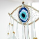Handmade dreamcatcher amulet with an evil eye nazar woven from natural thread Handmade dreamcatcher amulet with an evil eye nazar woven from natural thread - PhotoDune Item for Sale