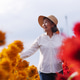 Happy Asian Senior Woman Walking Through Colorful Flower Field Happy Asian Senior Woman Walking Through Colorful Flower Field - PhotoDune Item for Sale