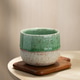 Japanese Style Ceramic Tea Cup on Wooden Coaster with Soft Natural Light Japanese Style Ceramic Tea Cup on Wooden Coaster with Soft Natural Light - PhotoDune Item for Sale