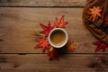 Cup of hot coffee and maple leaves on wooden table.Autumn season concept. Cup of hot coffee and maple leaves on wooden table.Autumn season concept. - PhotoDune Item for Sale
