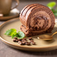 Chocolate roll cake on a plate. Chocolate roll cake on a plate. - PhotoDune Item for Sale