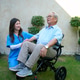 Senior man in wheelchair with caregiver in garden during sunny day Senior man in wheelchair with caregiver in garden during sunny day - PhotoDune Item for Sale