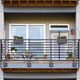 Beautiful modern neat apartment balcony decorated with colorful flowers and bird feeder Beautiful modern neat apartment balcony decorated with colorful flowers and bird feeder - PhotoDune Item for Sale