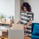 Concentrated store worker packing goods for shipping Concentrated store worker packing goods for shipping - PhotoDune Item for Sale