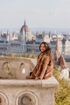 Portrait of beautiful young woman on balcony overlooking Hungarian Parliament in Budapest, Hungary Portrait of beautiful young woman on balcony overlooking Hungarian Parliament in Budapest, Hungary - PhotoDune Item for Sale