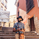 Stylish black man walking on the city street using smartphone Stylish black man walking on the city street using smartphone - PhotoDune Item for Sale