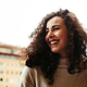 Happy curly hair young woman Happy curly hair young woman - PhotoDune Item for Sale